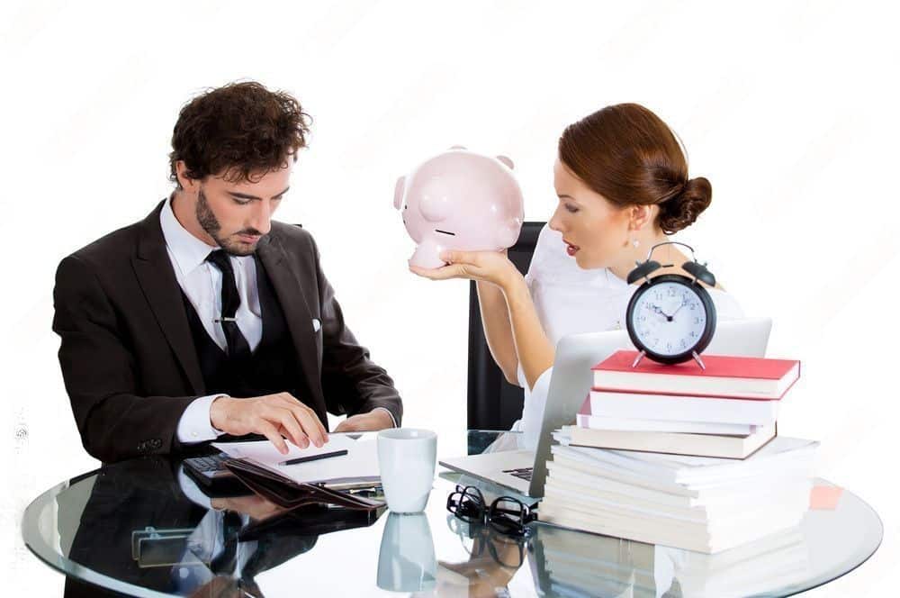 man and a woman are discussing about refinancing
