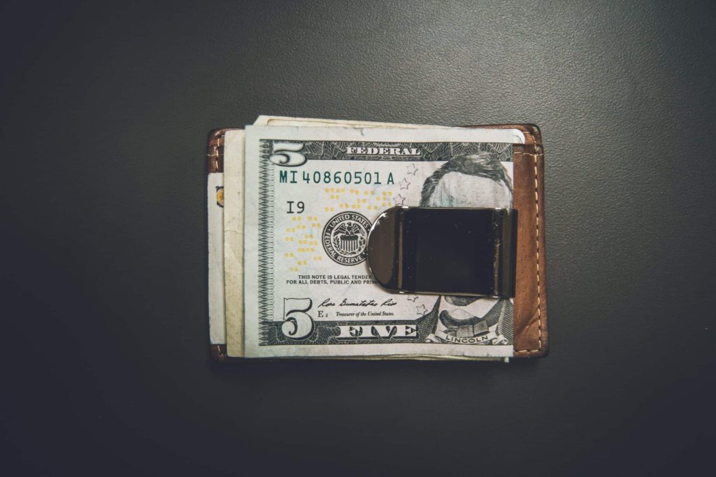 Stack of dollar note lying on a table