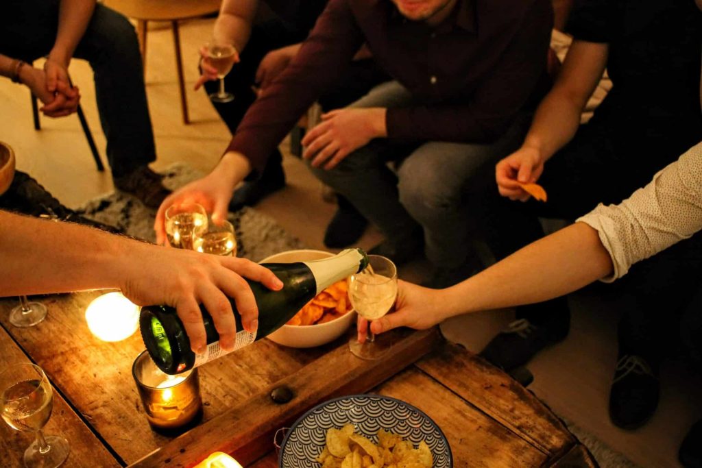 A group of friends having a get-together for discussing the divorce of one of them