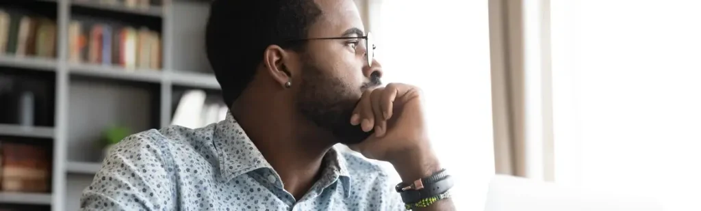 man thinking of questions to ask before marriage