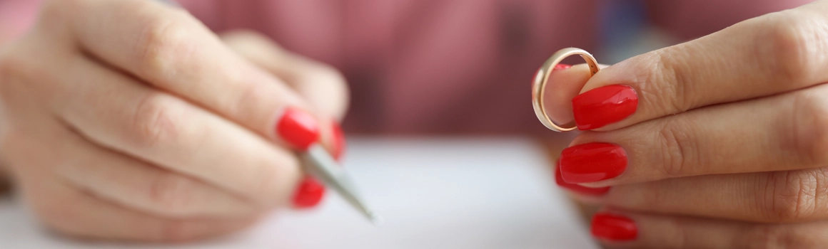 Woman holding wedding ring