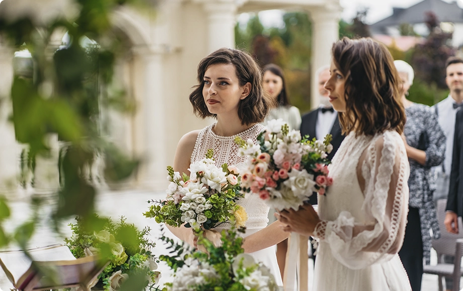 Lesbian brides telling vows at their wedding ceremony