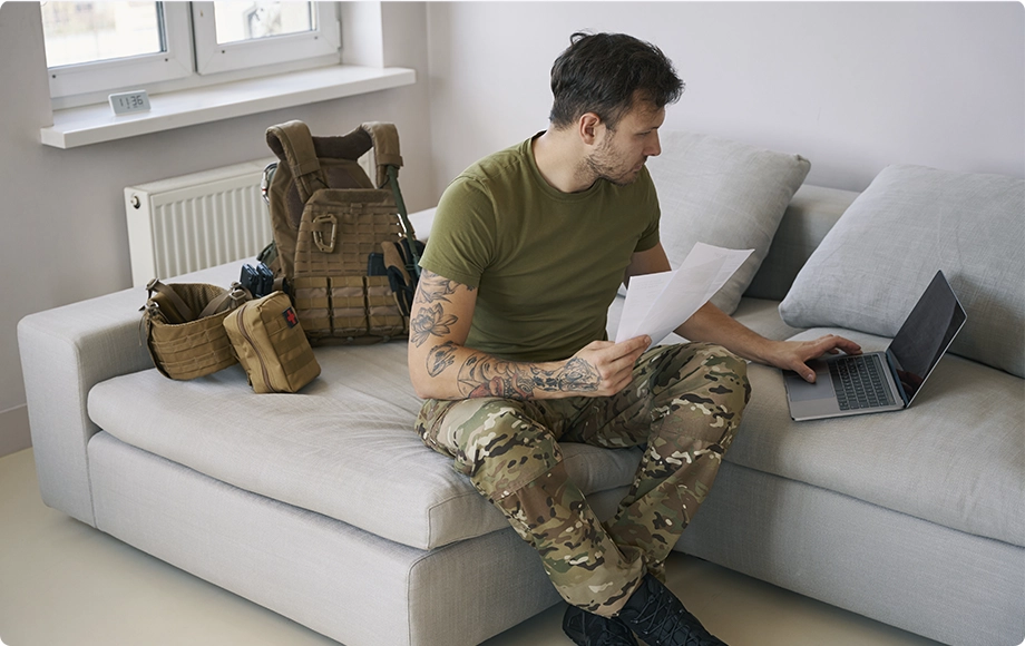 Soldier holding divorce papers and reviewing information 