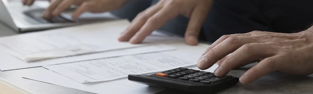 divorced couple work with financial papers