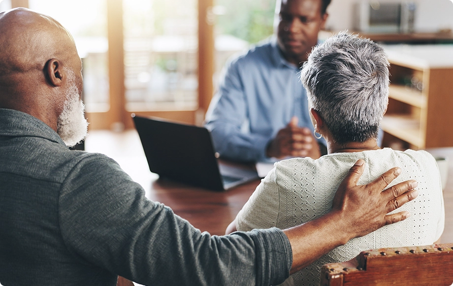 A divorced couple during a consultation with a financial advisor