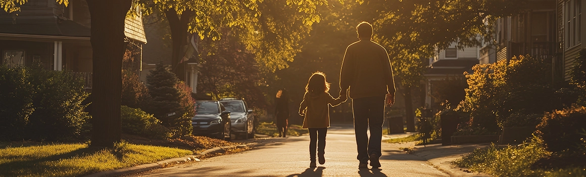 Dad and daughter Walking to School Bus at Sunset