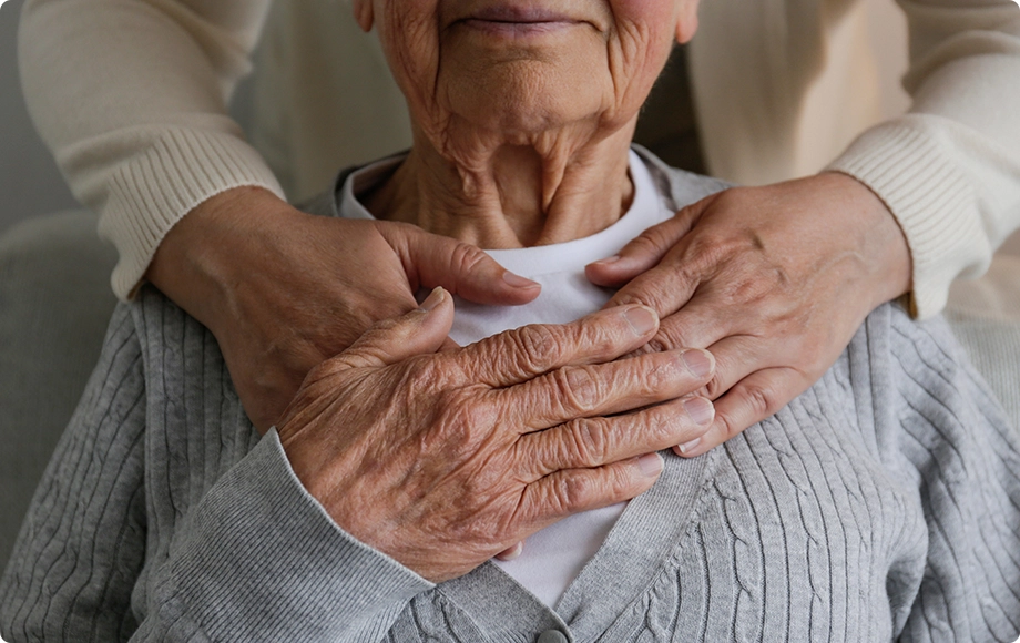 elderly parent being hugged by her guardianship daughter