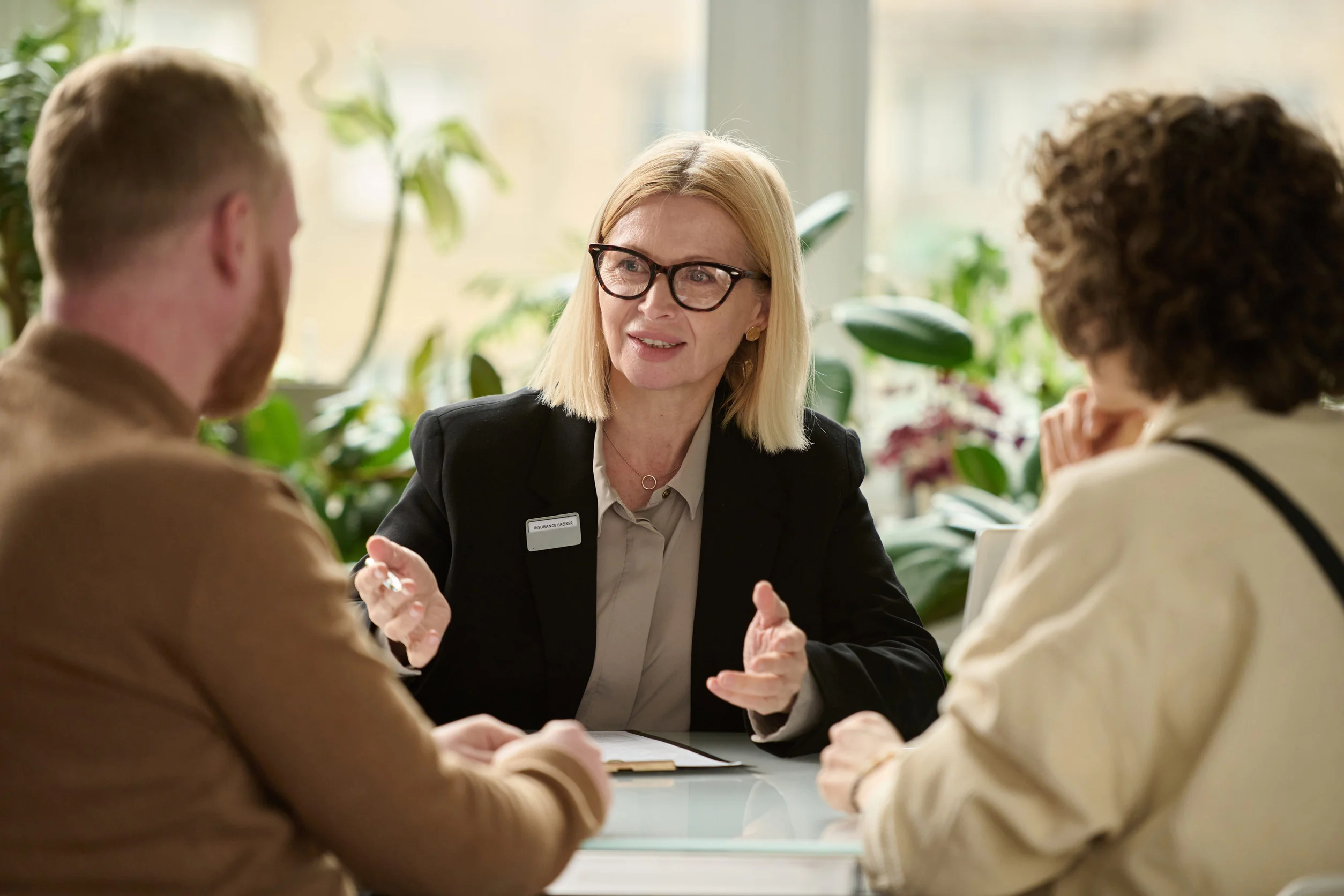 Person calculating spousal support estimates using a calculator and financial documents in Washington State