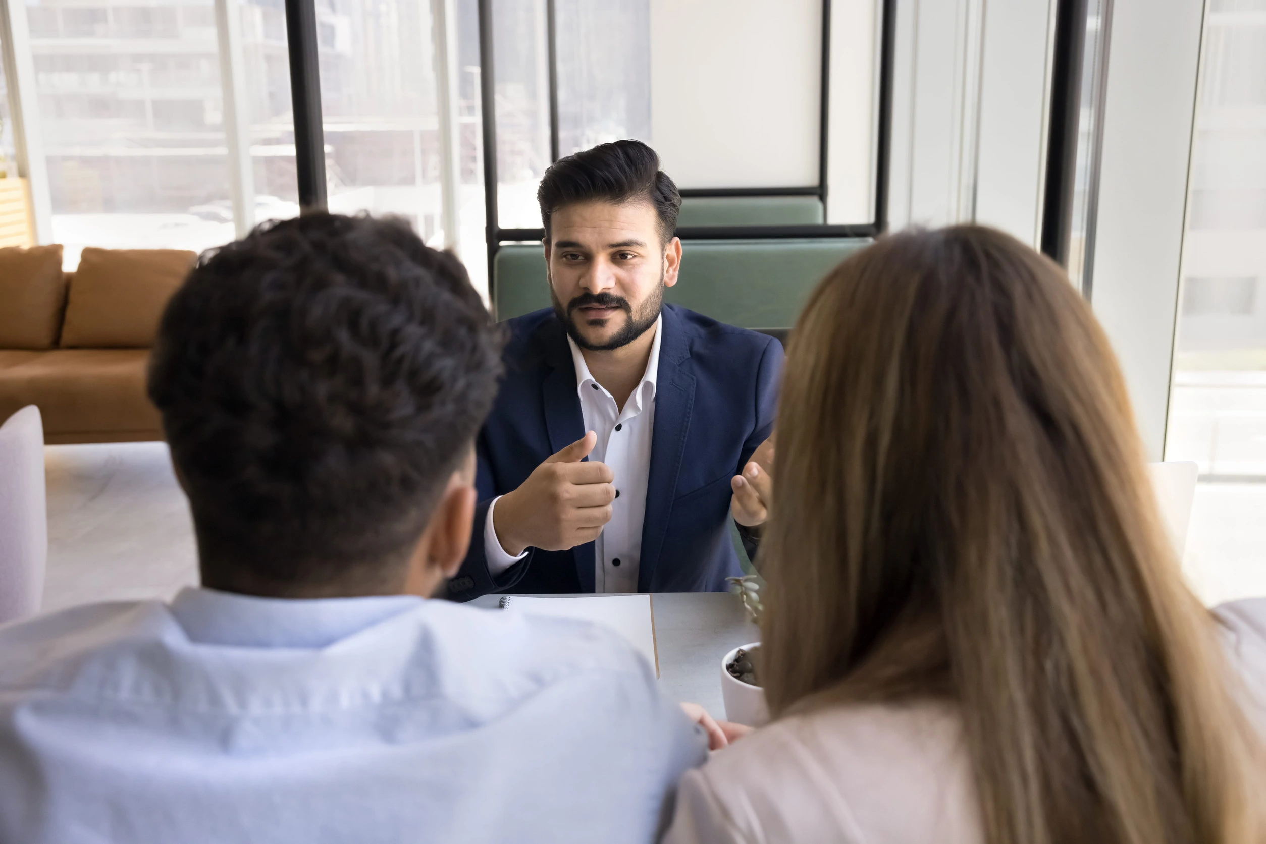 Attorney and client reviewing financial documents during a collaborative divorce consultation